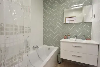a bathroom with a sink and a tub and a shower at 1-Br with Terrace Carré dOr Walking Distance to the Beaches in Cannes