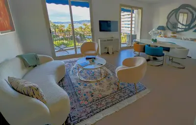 a living room with a couch and chairs and a table at Ref DUNES3 by Palmes d Or Properties in Cannes