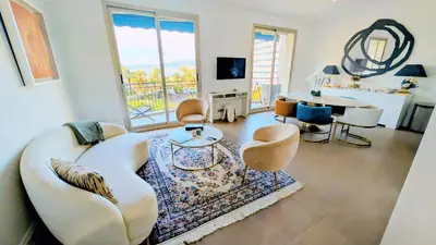 a living room with a couch and chairs and a table at Ref DUNES3 by Palmes d Or Properties in Cannes