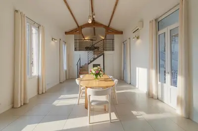 two beds in a room with blue and white at MIPIM Walk-to-Palais 100sqm Loft 2 Ensuite Suites 3 Bathrooms Terrace Business Ready in Cannes