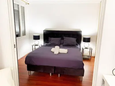 a bedroom with a bed with a white towel on it at Villa St Marc - Standing Presta in Cannes