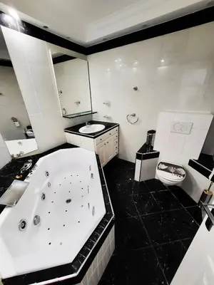 a large bathroom with a tub and a toilet at Villa St Marc - Standing Presta in Cannes