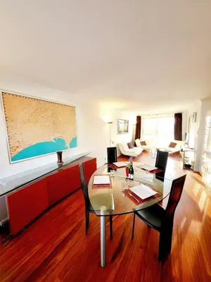 a dining room with a table and chairs at Villa St Marc - Standing Presta in Cannes
