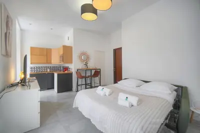 a bedroom with a large bed with two pillows on it at La Terrasse in Cannes