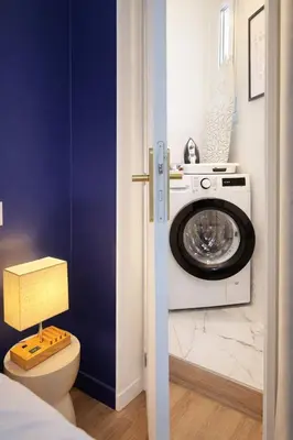 a bedroom with a large bed with a window at Suite Paloma - Palais & Croisette 1min - 2 chambres - Appartement Hôtel in Cannes