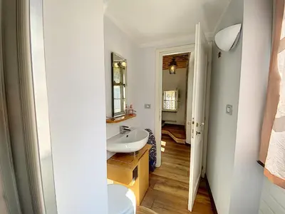 a bathroom with a sink and a mirror at Saint Antoine Mas1410 in Cannes