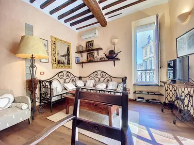 a living room with a piano and a table in it at Saint Antoine Mas1410 in Cannes