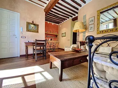 a living room with a bed and a dining room at Saint Antoine Mas1410 in Cannes