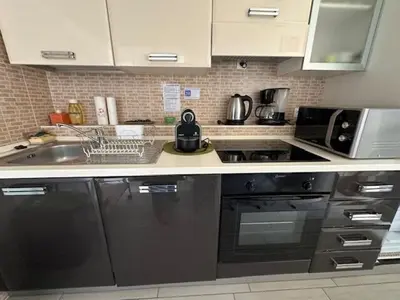a kitchen with a sink and a microwave at Studio w parking, close to film Festival Palace in Cannes