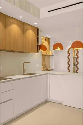 a white kitchen with wooden cabinets and a sink at 121 MARECHAL - 3-Bedroom Apartment Sea View and Parking in Cannes