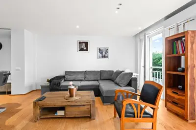 a living room with a couch and a table at Luxueux deux pièces - Proche de la mer - FU in Cannes