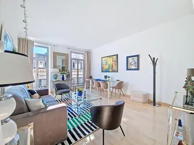 a living room with a couch and a table at Cannes 2 bedrooms & 2 bathrooms Apartment - 43A in Cannes