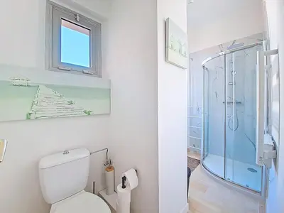 a bathroom with a toilet and a glass shower at Cannes 2 bedrooms & 2 bathrooms Apartment - 43A in Cannes