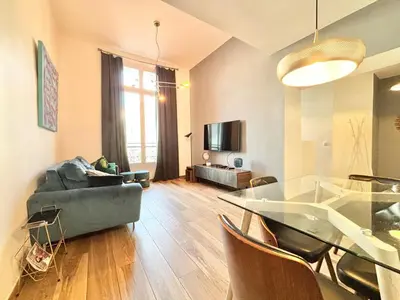 a living room with a glass table and a couch at Cannes 1 bedroom apartment - 9BC in Cannes