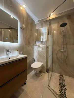 a bathroom with a toilet and a sink and a shower at Cannes Center Appartement F9 in Cannes