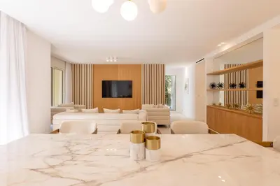 a living room with a large marble table and chairs at 002 Villa Camille in Cannes