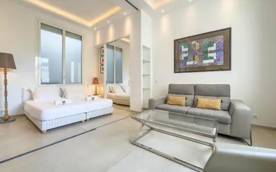 a living room with a couch and a table at 303 Le Gallia in Cannes