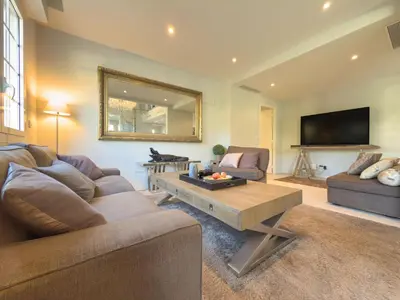 a living room with a couch and a table at Eclat by Winsome Destination in Cannes