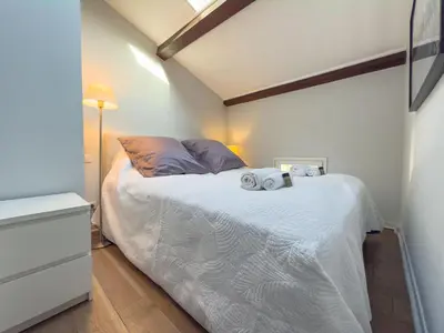 a bedroom with a bed with two towels on it at Eclat by Winsome Destination in Cannes
