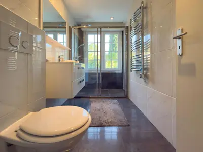 a bathroom with a toilet and a sink and a shower at Eclat by Winsome Destination in Cannes