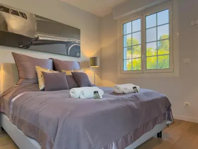a bedroom with a large bed with towels on it at Eclat by Winsome Destination in Cannes