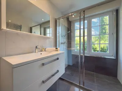 a bathroom with a sink and a shower at Eclat by Winsome Destination in Cannes