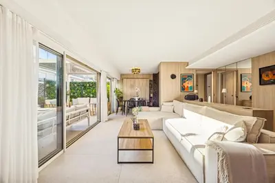 a living room with a couch and a table at Magnifique appartement à 50 mètres de la Croisette in Cannes
