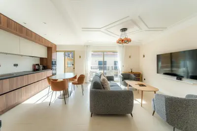a living room with a couch and chairs and a table at Magnifique appartement dans le carré d'or à Cannes in Cannes