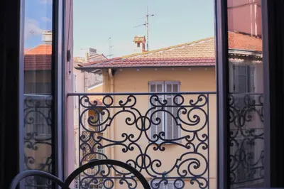an open window with a view of a building at SUITE DE LUXE PINK LADY 4P in Cannes
