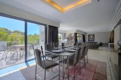 a dining room with a table and chairs at Villa Lou Bayou French Riviera near Cannes in Vallauris