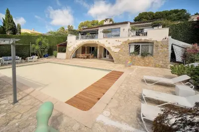 a villa with a swimming pool and a house at Villa Lou Bayou French Riviera near Cannes in Vallauris