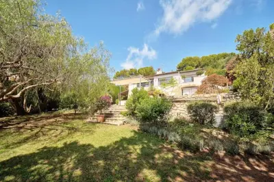 a house on a hill with a yard at Villa Lou Bayou French Riviera near Cannes in Vallauris