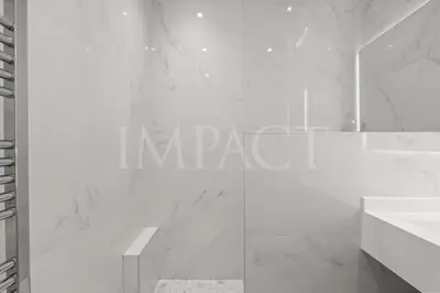 a white bathroom with a sink and a mirror at REF 2023- Cannes Croisette - Apartment to rent in Cannes