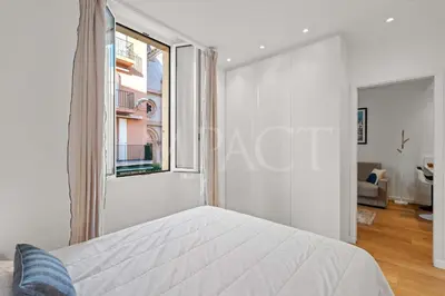 a white bedroom with a bed and a window at REF 2023- Cannes Croisette - Apartment to rent in Cannes