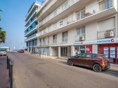 a car parked in front of a building at Apartment Reine Astrid-5 by Interhome in Cannes