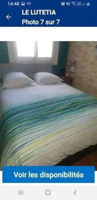 a picture of a bed in a room at Le lutetia in Cannes