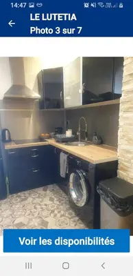 a kitchen with a sink and a counter with a washing machine at Le lutetia in Cannes