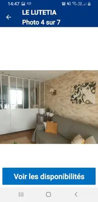 a picture of a living room with a couch at Le lutetia in Cannes