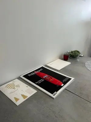 a table with brochures and pamphlets on it at Appartement luxe Jaccuzi marbre et terrasse in Cannes