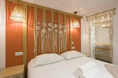 a bedroom with a white bed with two pillows at Majopi 2 - Central, AC, close to Palais & beaches in Cannes