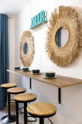 a counter with stools and mirrors on a wall at Majopi 2 - Central, AC, close to Palais & beaches in Cannes