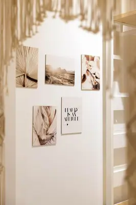 a collage of photographs on a white wall at Majopi 2 - Central, AC, close to Palais & beaches in Cannes