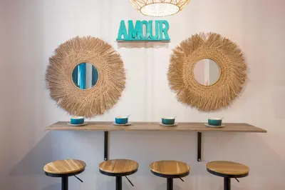 a row of stools with mirrors on a wall at Majopi 2 - Central, AC, close to Palais & beaches in Cannes