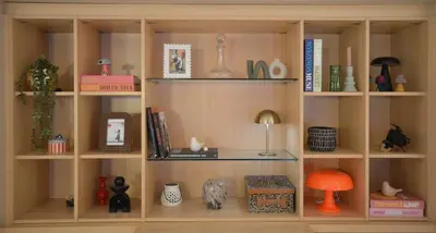 a book shelf filled with lots of books at Wiosna- Quiet 1 Bedroom in Cannes