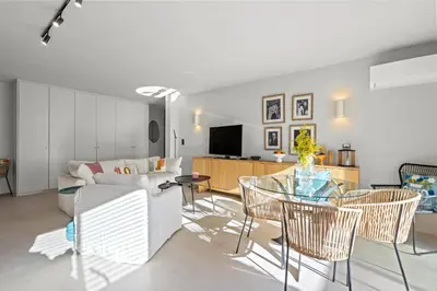 a living room with a couch and a table and chairs at REF 2037 - Apartment for Rent Sea View in Cannes