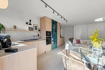 a kitchen and living room with a table and chairs at REF 2037 - Apartment for Rent Sea View in Cannes