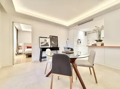 a kitchen and dining room with a table and chairs at Cannes 2 bedrooms & 2 bathrooms apartment - 24P2 in Cannes