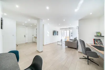 a white living room with chairs and a couch at 3 pièces rénové en bord de mer - Terrasse in Cannes
