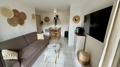 a living room with a couch and a table at Sea Cocoon La Bocca in Cannes