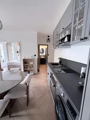 a kitchen with wooden stools and a counter top at Premium address for trade shows and conferences in Cannes 5min walk to Palais des Festivales in Cannes